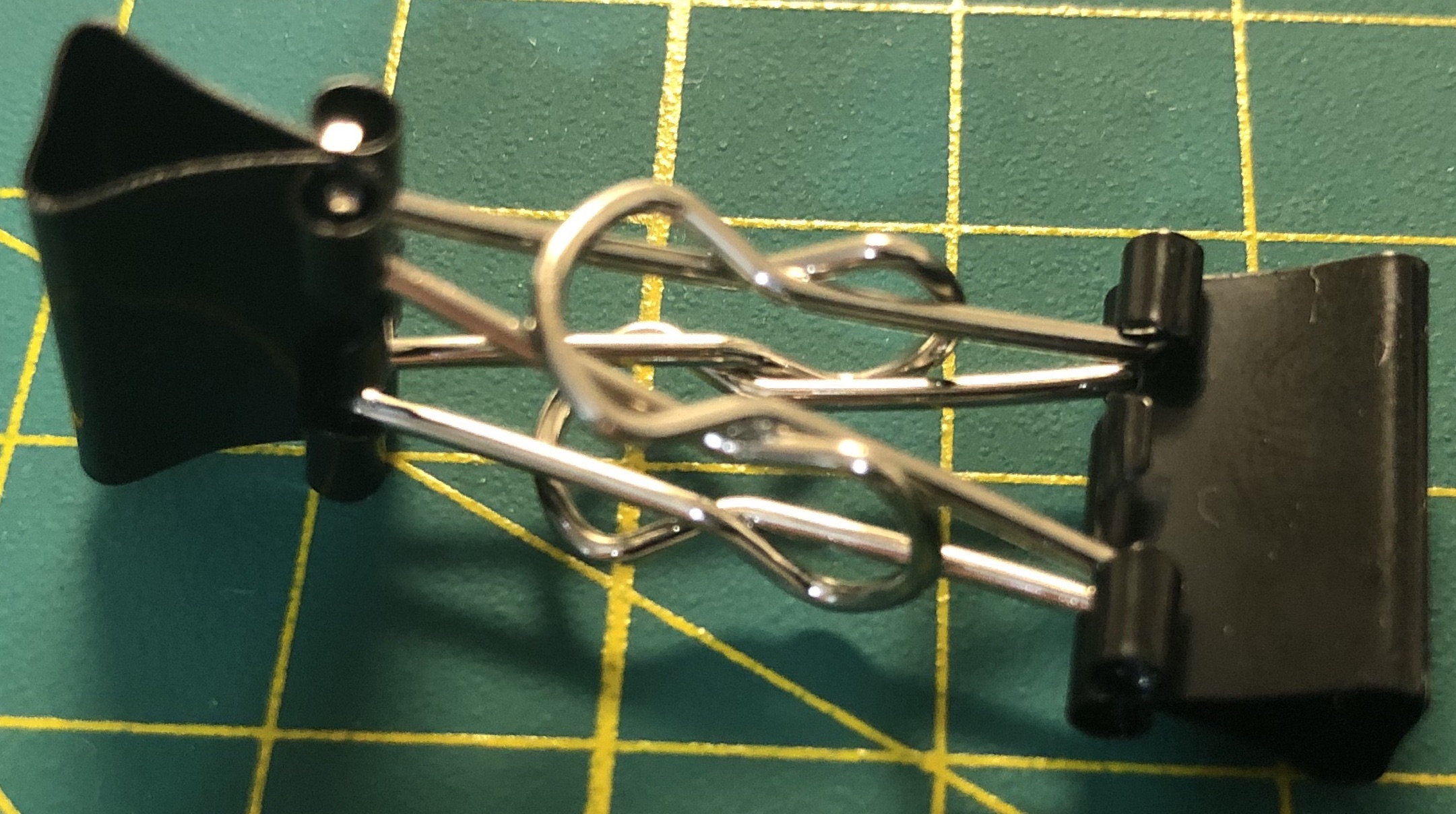 2 binder clips hold hand to hand