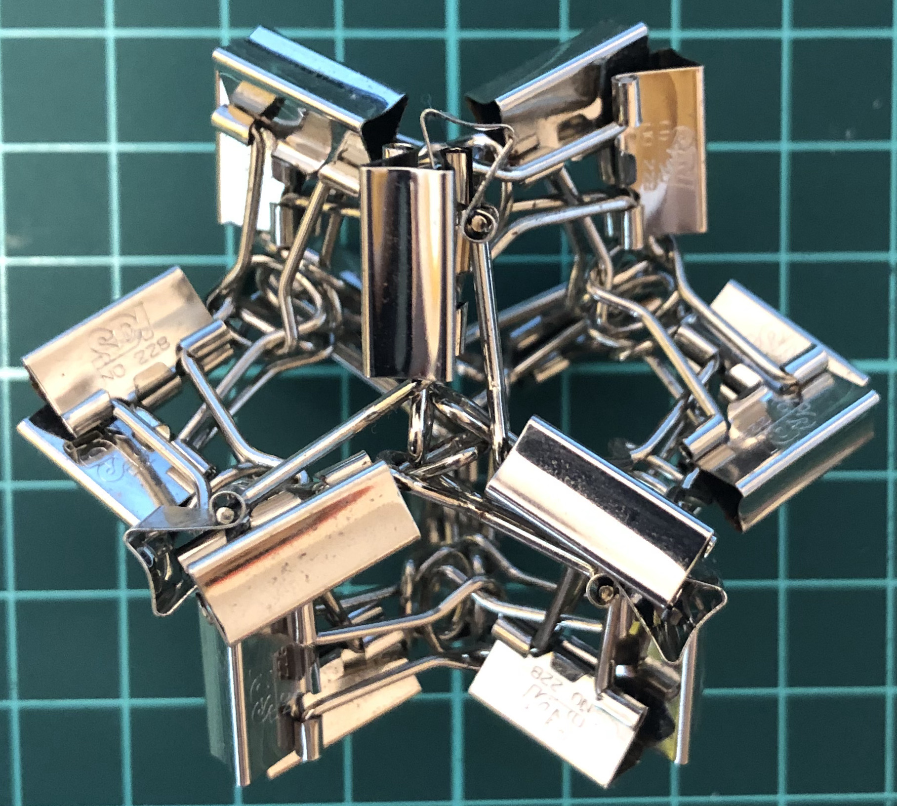 24 clips forming 12 L-edges forming cube